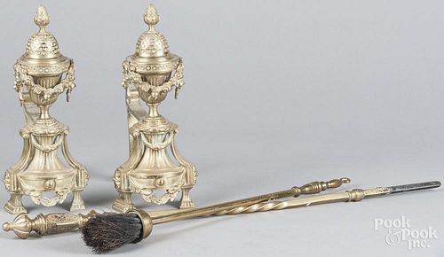 Pair of French brass chenets, 12 1/2'' h., together with a poker and broom.