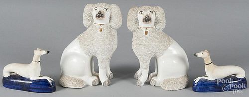 Pair of Staffordshire spaniels, 19th c., together with a pair of whippet inkwells, 10 1/2'' h. and 5