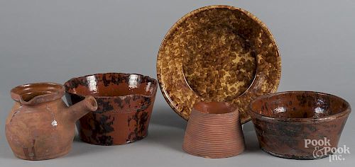 Five pieces of Pennsylvania redware, 19th c., largest bowl - 3'' h., 11 1/4'' dia.