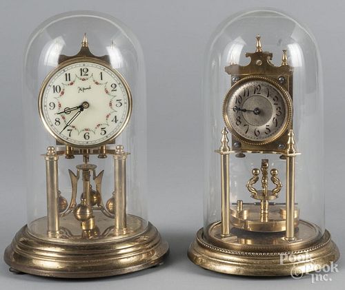 Two German brass shelf clocks, with glass domes, 12'' h.