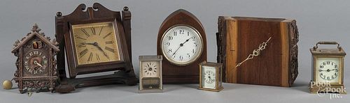 Seven assorted shelf and wall clocks.