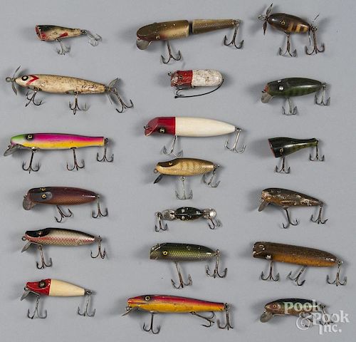 Twenty-four Paw Paw wood fishing lures, longest - 4 1/2''.