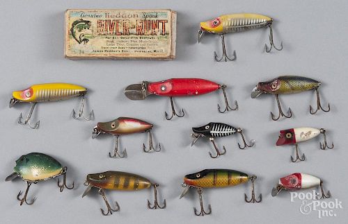 Ten Heddon River Runt fishing lures, two wood with glass eyes, others plastic, including one in the