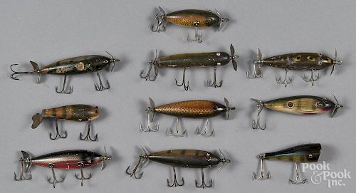 Seven Creek Chub wood injured minnow fishing lures, together with a plastic example, a plunker and a