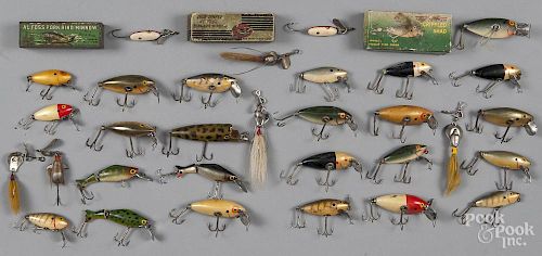 Twenty-seven Al Foss crippled shad and pork rind minnow fishing lures, three in original boxes, toge