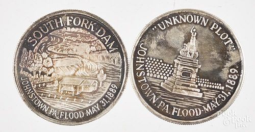 Two Johnstown Flood 100th Anniversary commemorative silver rounds.