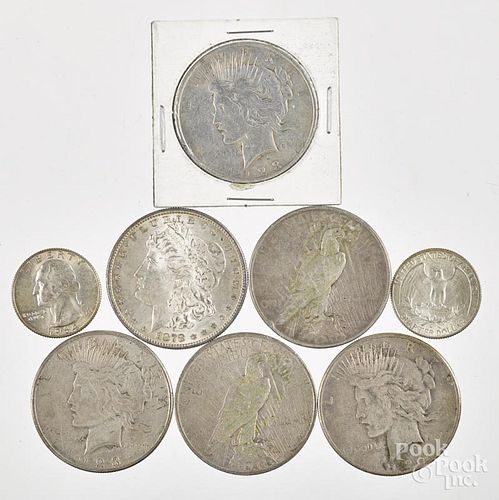 Six silver dollars, to include an 1878 S Morgan silver dollar, five Peace dollars, and two silver qu