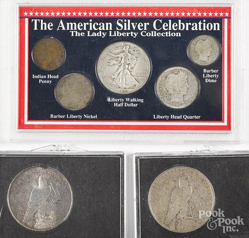 Two silver Peace dollars, together with three US silver Celebration sets.