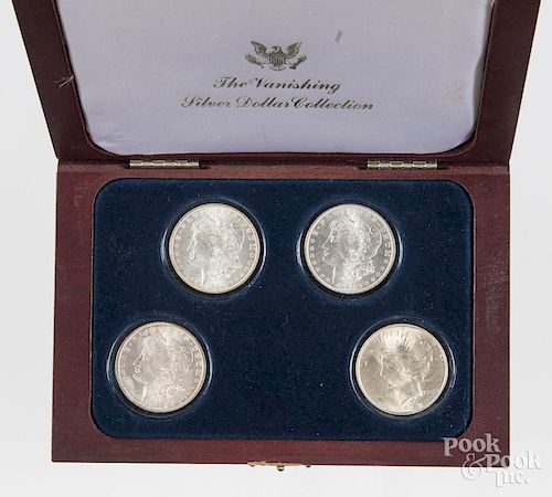 The Vanishing Silver Dollar Collection, to include three Morgan dollars, 1883 O, 1884 O and 1885 O,