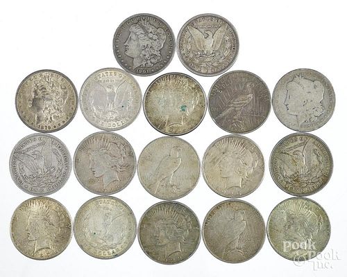 Eight Morgan silver dollars and nine Peace dollars.