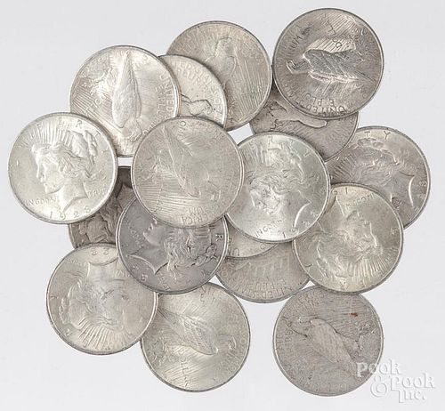 Seventeen 1923 silver Peace dollars.