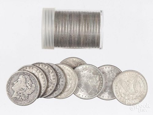 Twenty-nine Morgan silver dollars, to include twenty-five 1921, an 1883, 1880, 1884, and 1899 O.