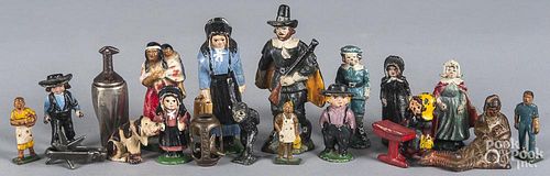 Group of cast iron paperweights, to include Amish figures, pilgrim, Native American Indian, etc., ta