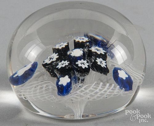 New England Glass Company spaced millefiori paperweight on a white latticinio ground, the central ca