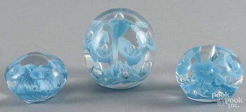 Set of three St. Clair, Indiana floral paperweights, illustrating the stages of making a paperweight