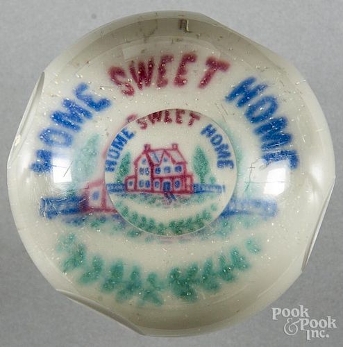 Colored frit Home Sweet Home paperweight on a white ground, with top and side facets, 3 3/8'' dia.