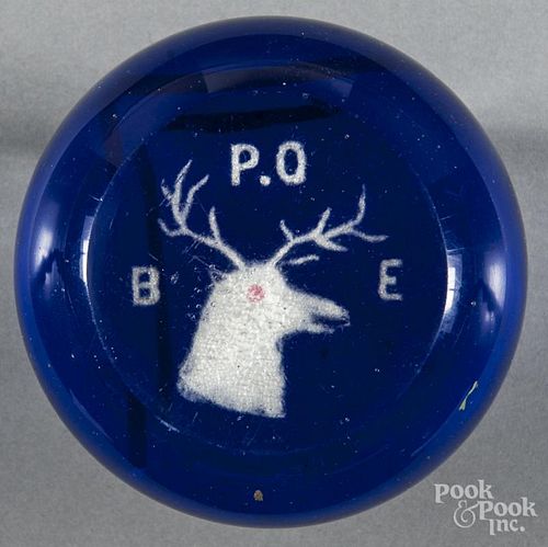 Elks Club frit paperweight, marked B. P. O. E. on a translucent cobalt ground, with top facet, 3 3