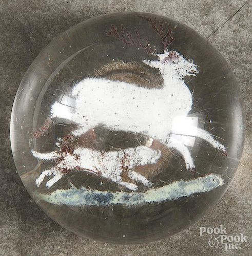 Colored frit hunting scene paperweight, with a dog chasing a stag, 3 1/2'' dia.