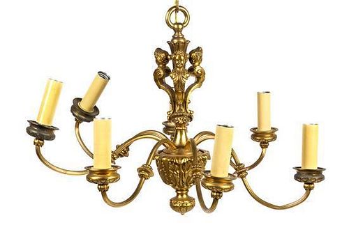 * A Neoclassical Style Gilt Metal Seven-Light Chandelier Height 26 x diameter 25 inches.