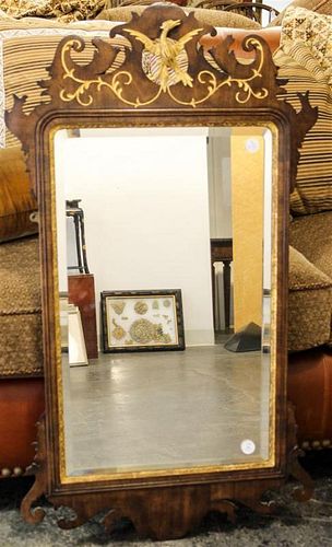 * A Chippendale Style Parcel Gilt Mahogany Mirror Height 40 1/2 x width 22 1/2 inches.