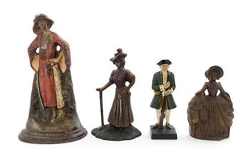 Four Cast Iron Doorstops Height of tallest 11 1/2 inches.