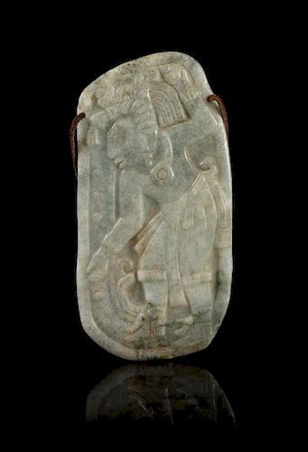 * A Celadon Jade Plaque Carved with a Mexican Figure. Height 6 1/4 inches.
