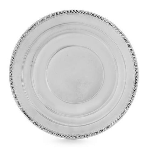 An American Silver Dish, , having a gadrooned rim and a stepped border.
