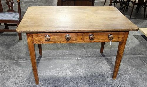 An American Walnut Worktable Height 29 1/2 x width 46 1/4 x depth 28 3/8 inches.