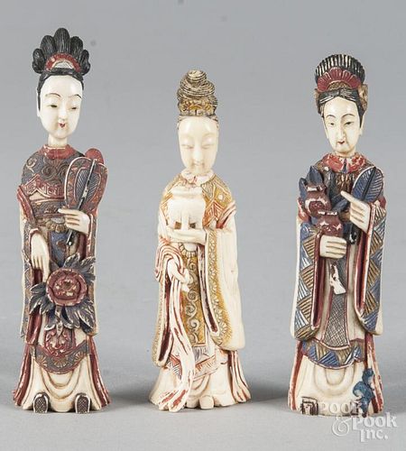 Three Chinese carved and painted ivory figural snu