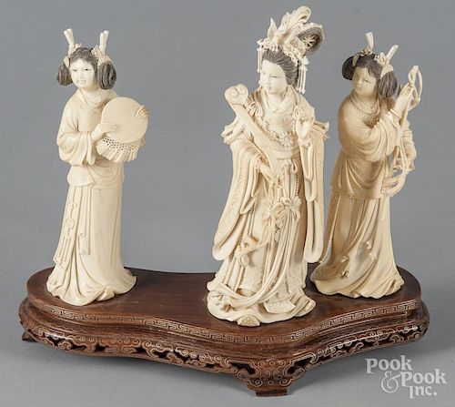 Three Chinese carved ivory female figures, early 2