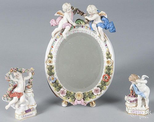 Two Meissen porcelain putti figures, together with