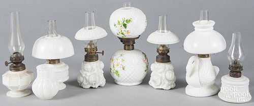 Collection of milk glass fairy lamps and shades.