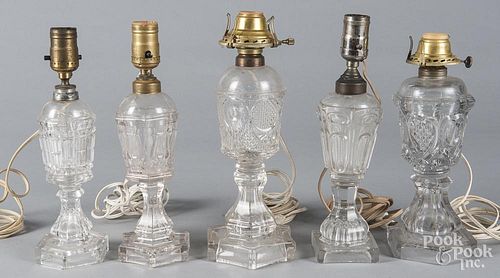 Five pressed glass table lamps, 19th .