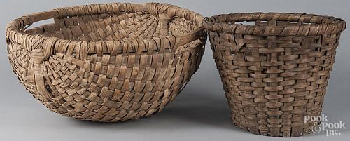 Two large split oak baskets, together with a broom