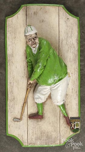 Painted composition plaque of a golfer, 23" x 12 1