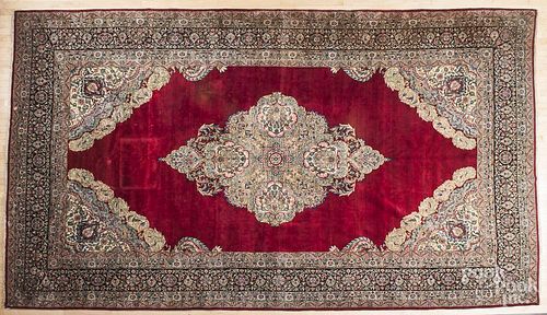 Semi-antique Kirman carpet, 16'10" x 9'9".