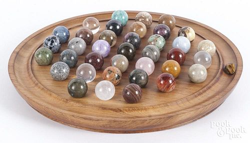 Collection of glass and stone marbles.