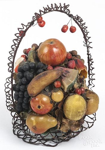 Wire basket fitted with an assortment of wax fruit