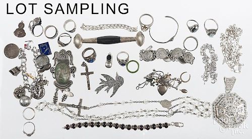 Collection of sterling silver jewelry and objects, to include two charm bracelets, several chains, a