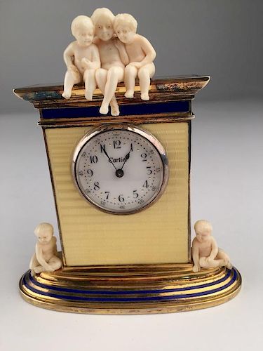 Cartier figural desk clock with three young children on the very top and another