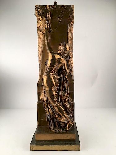 Gold gilt bronze figure of a lady leaning against a wall, artist signed.