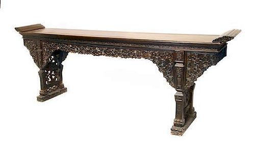A Massive Chinese Carved Hardwood Altar Table, Height 45 1/4 x width 128 x depth 20 1/2 inches.