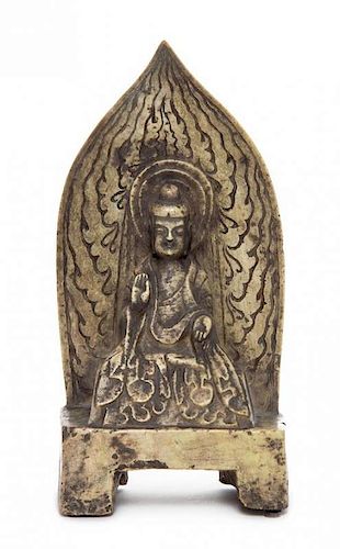 A Carved Limestone Figure of Shakyamuni Buddha, Height 12 inches.