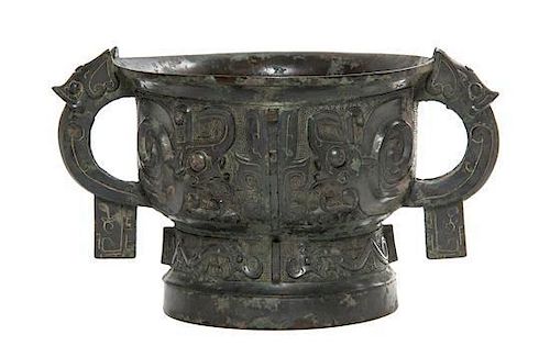 A Chinese Bronze Ritual Gui Vessel, Width over handles 10 5/8 inches.