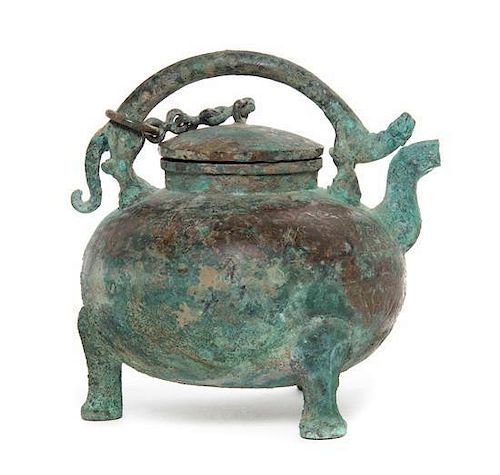A Bronze He Pouring Vessel, Height 9 1/4 inches.
