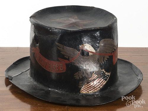 Painted fire parade hat with later decoration, 5'' h., 10 1/2'' w., 12'' d.