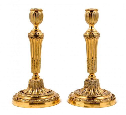 A Pair of Continental Gilt Metal Candlesticks Height 11 inches.