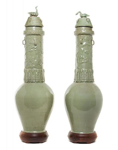 A Pair of Chinese Celadon Glazed Pottery Funerary Urns Height of tallest 32 1/8 inches.
