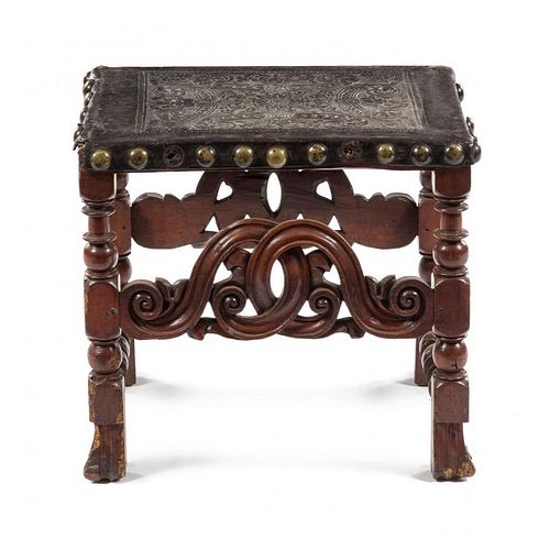 A Jacobean Style Leather-Upholstered Bench Height 19 1/4 x width 21 3/4 x depth 17 1/4 inches.