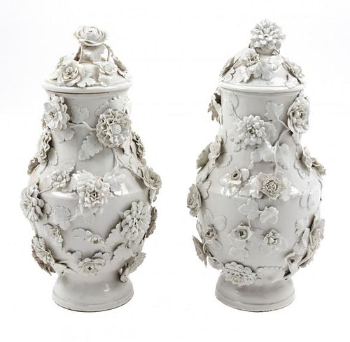 A Pair of Vienna Blanc-de-Chine Porcelain Urns and Covers Height 13 1/2 inches.
